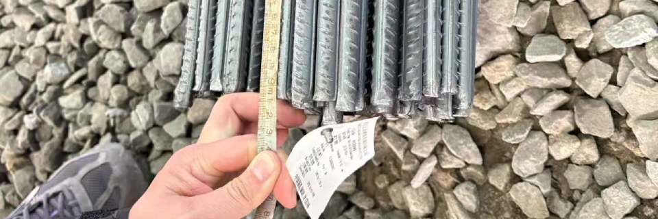 Workers are measuring the length of the steel bars Workers are measuring the length of the steel bars